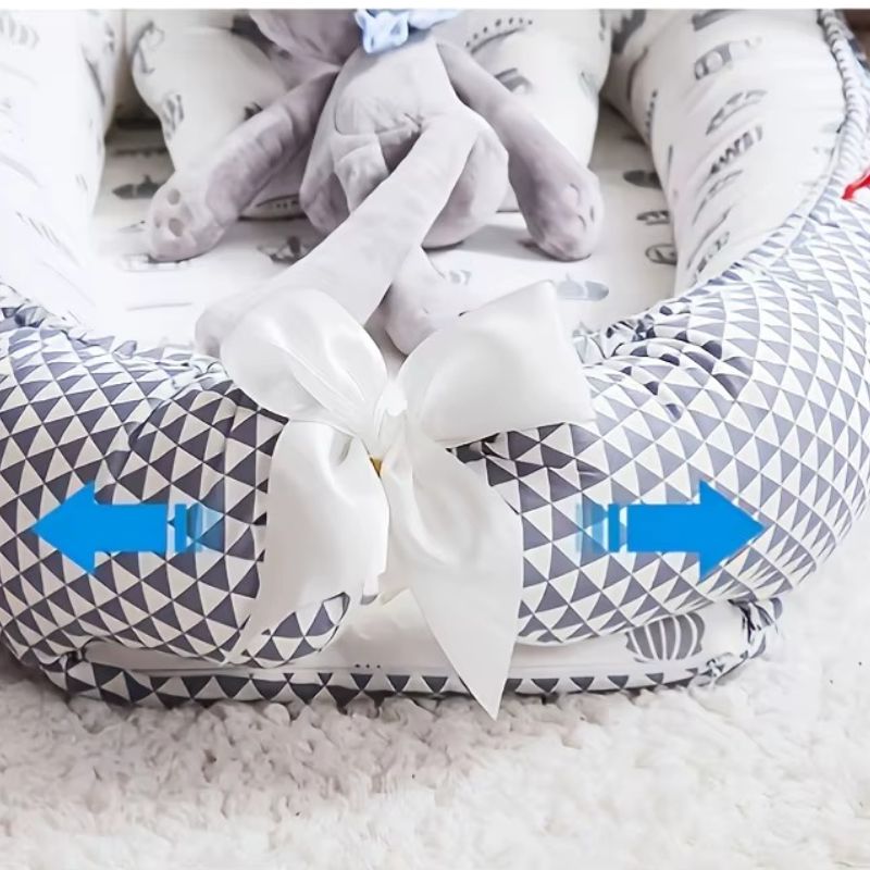 Réducteur de lit bébé