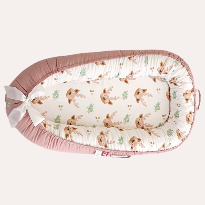 Réducteur de lit bébé